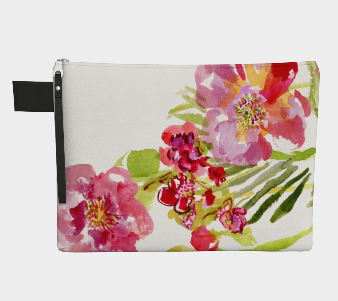 white zippered carry all hand bag with hand painted flowers in pink, red and yellows accompanied by green leaves and stems. A zipper hangs from the top of the bag in the upper left corner. Attached to the zipper is a strip of black vegan leather. A small black pull tab stick out to the left of the bag near the upper left corner. 