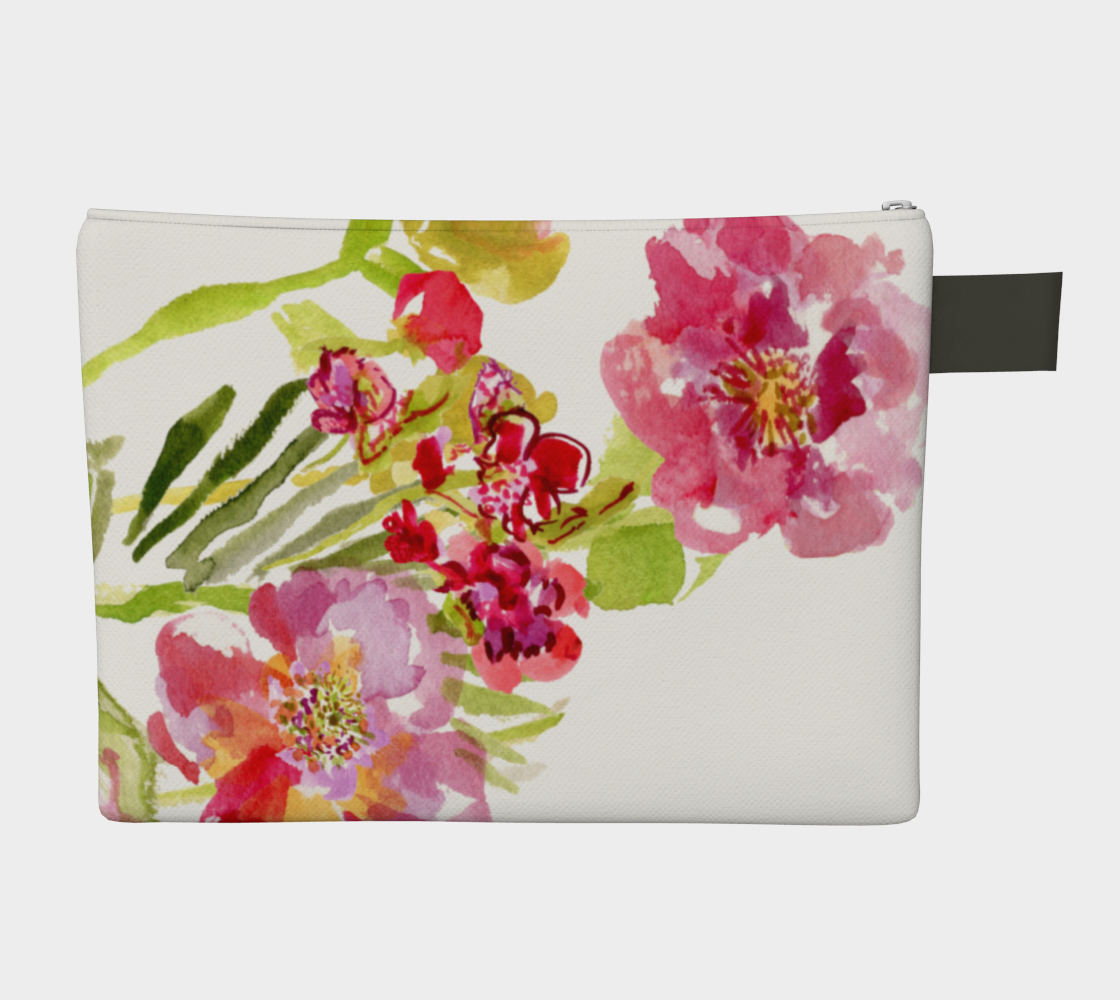 white zippered carry all hand bag with hand painted flowers in pink, red and yellows accompanied by green leaves and stems. A zipper hangs from the top of the bag in the upper left corner. Attached to the zipper is a strip of black vegan leather. A small black pull tab stick out to the left of the bag near the upper left corner. 